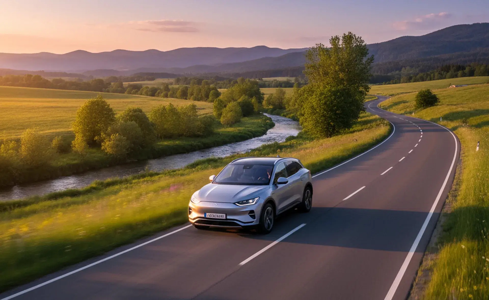 Car driving on road showing importance of proper tire maintenance
