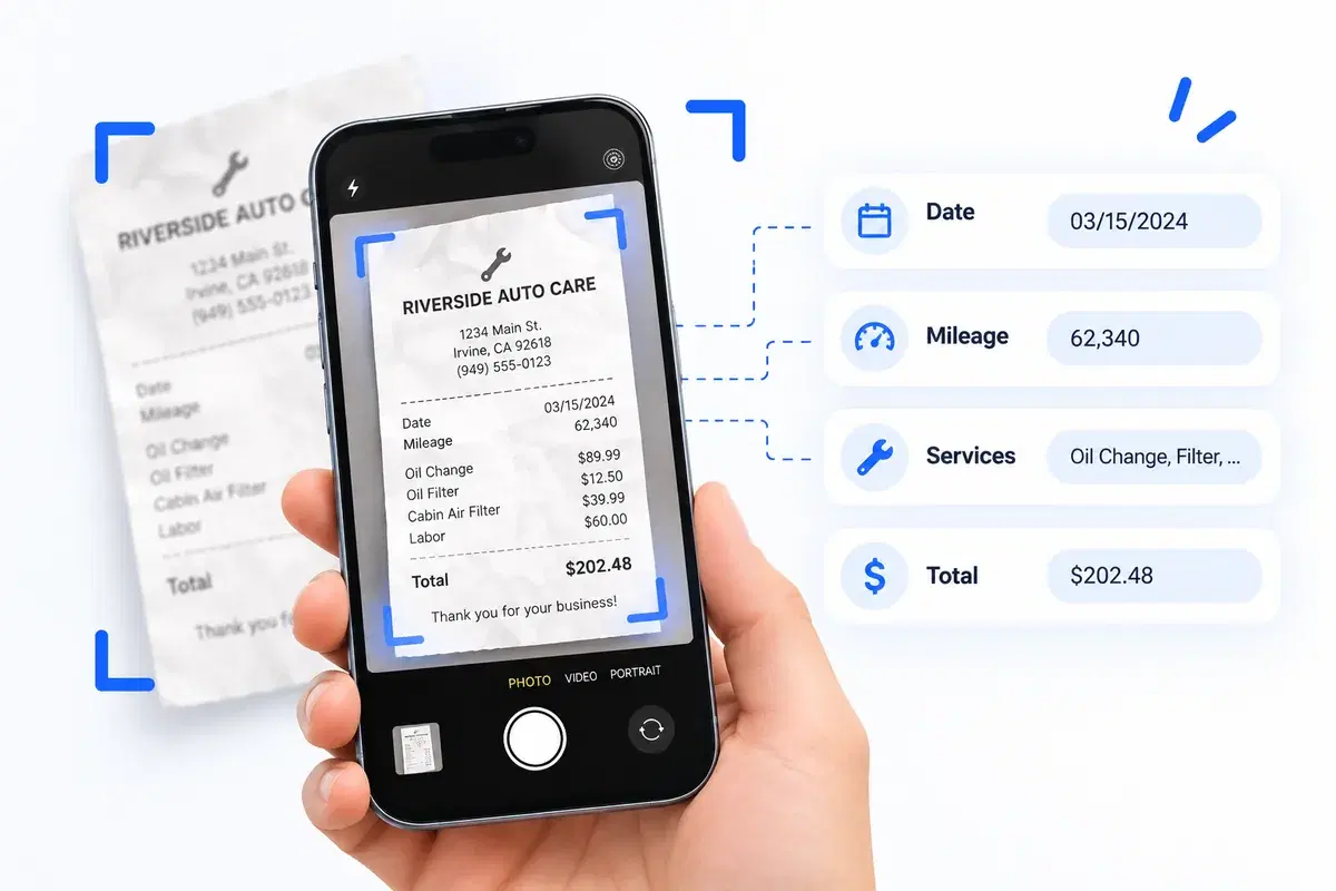 A phone photographing a paper service invoice, with the date, mileage, services performed and total lifted off the page as separate fields.